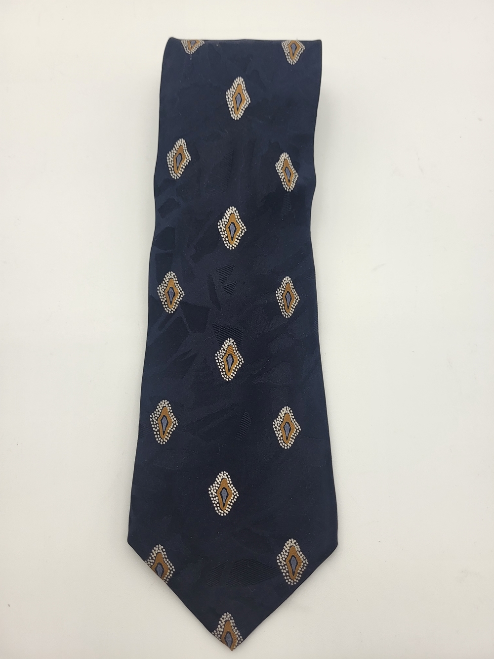 Navy Silk Tie with Bronze, white And Blue Medallion Motif And Pattern Under
